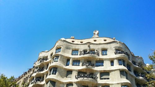 Low angle view of building against blue sky