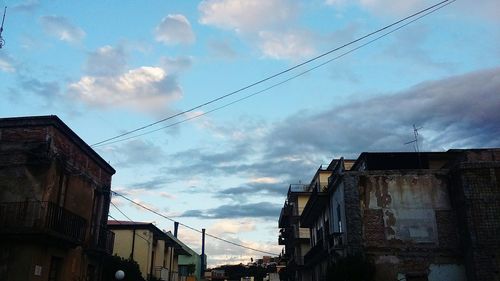 Low angle view of houses against sky