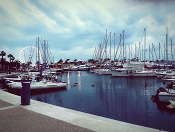 Boats moored at harbor