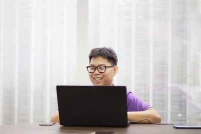 Mid adult man using smart phone