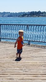 Full length of woman walking on pier