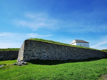 House on field against sky