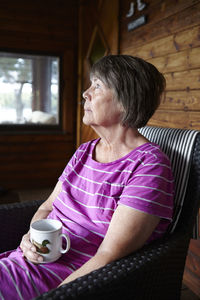 Senior woman having drink