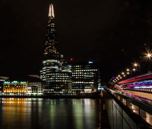 Illuminated buildings in city at night