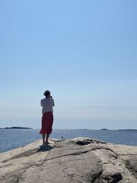 Scenic view of sea against clear blue sky