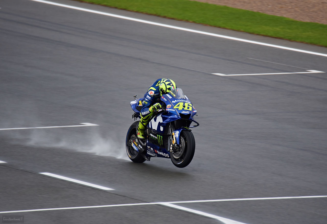 HIGH ANGLE VIEW OF PERSON RIDING MOTORCYCLE