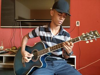 Young man playing guitar