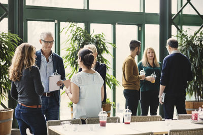 Groups of creative business people discussing in office