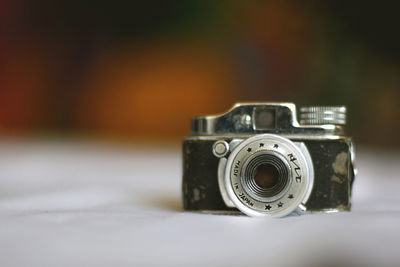 Close-up of camera on table