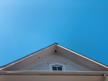 Low angle view of building against blue sky