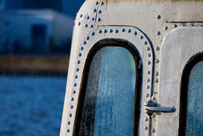 Close-up of chain on window of building