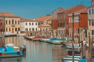 Boats moored at dock