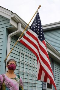 Low angle view of woman admiring united states flag