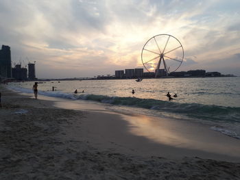 Scenic view of beach against sky during sunset