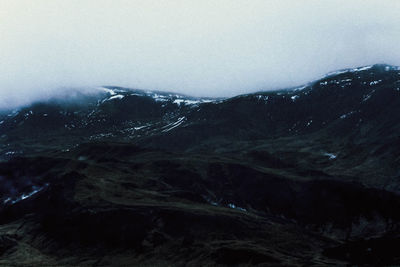 Scenic view of mountains against sky during winter