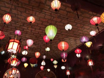 Low angle view of illuminated lanterns hanging in caf�