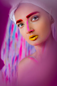 Portrait of beautiful young woman with face paint
