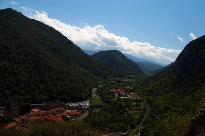 High angle view of houses and mountains against sky