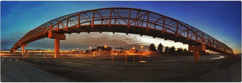 Bridge over river against blue sky