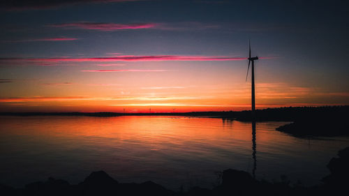 Scenic view of lake against romantic sky at sunset