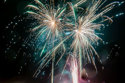 Long exosure of people letting off fireworks.