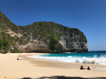 Scenic view of beach against clear sky