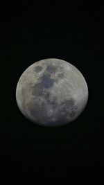 Low angle view of moon against sky at night