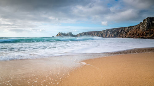 Scenic view of beach against sky