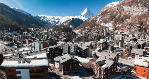 High angle view of townscape against mountain