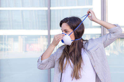 Woman looking away while wearing mask