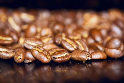 Close-up of coffee beans on table