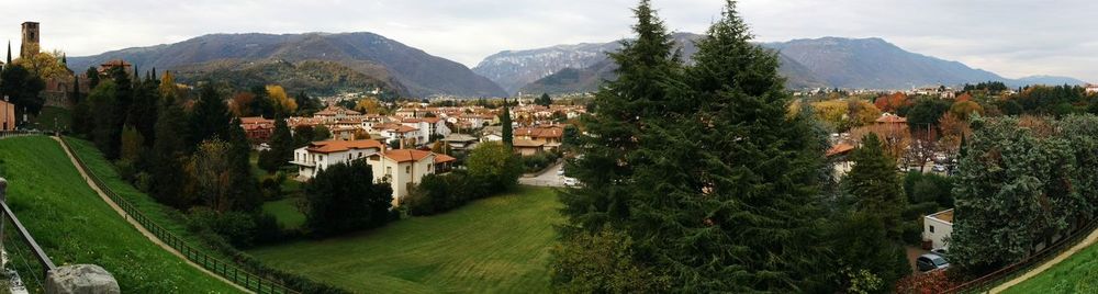 Panoramic view of trees and mountains against sky