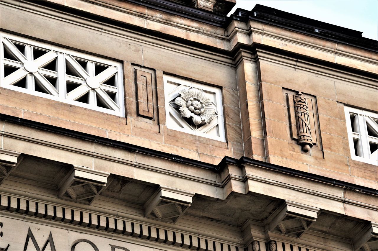 LOW ANGLE VIEW OF BUILDING FACADE