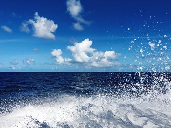 Scenic view of sea against blue sky