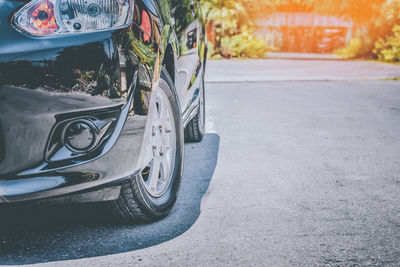 Close-up of car on street