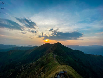 Scenic view of mountains against sky during sunset