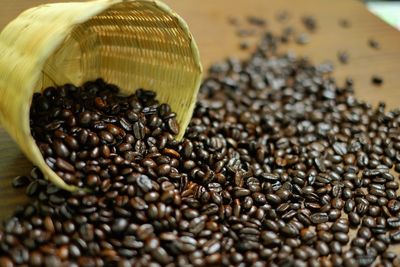 Close-up of roasted coffee beans on table