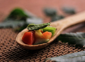 Close-up of fresh fruits in basket on table