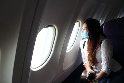 Woman sitting in airplane