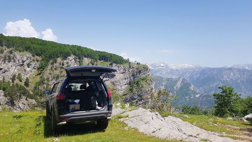 Car on mountain against sky