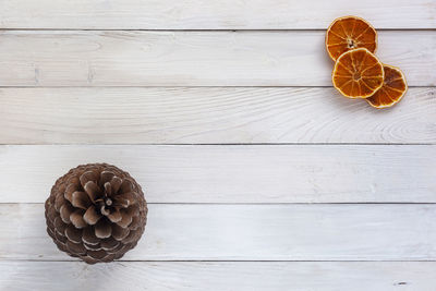 High angle view of pine cone on table