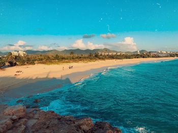 Scenic view of sea against blue sky