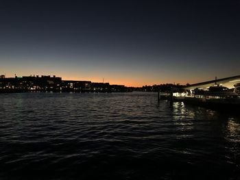 View of bridge over river against sky at sunset