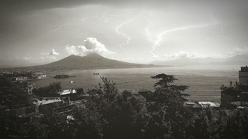 Scenic view of sea against storm clouds