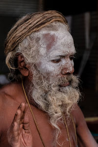 Close-up portrait of man wearing mask