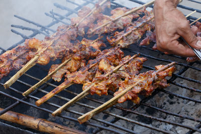 High angle view of meat on barbecue grill