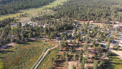 High angle view of field and buildings in city