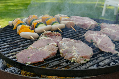 High angle view of meat on barbecue grill