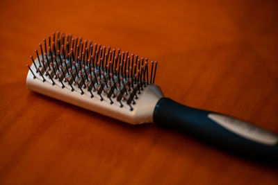 High angle view of comb on table