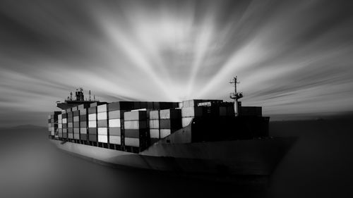 Black and black motion blur ship container transporting large cargo logistic import export goods 